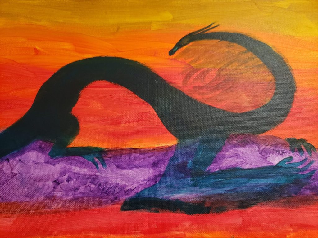 Sunrise draconic monster sprawling across the mountains.